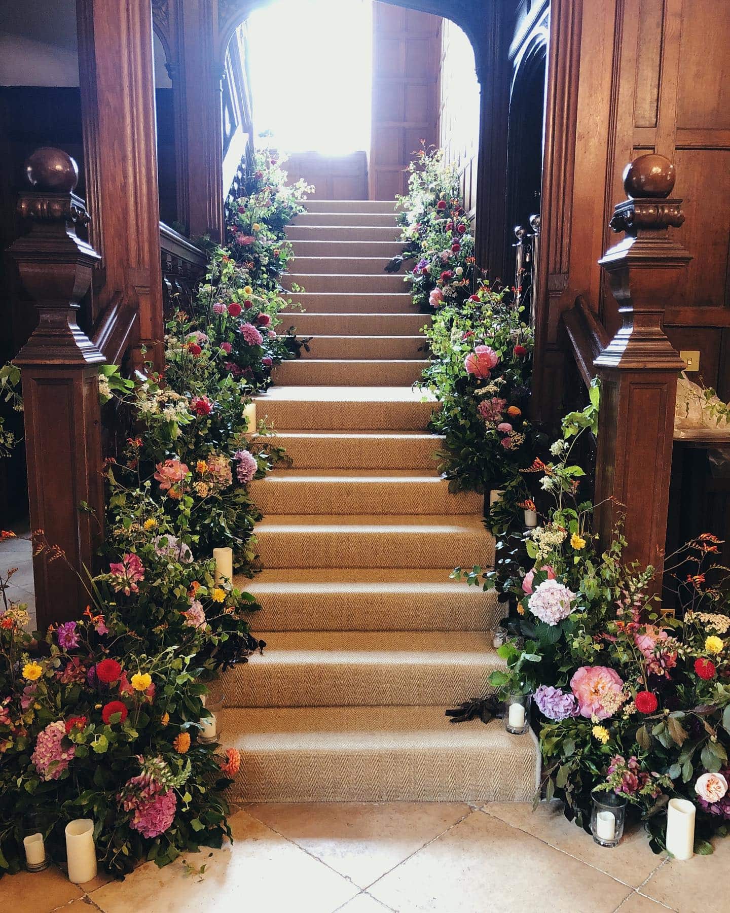 Staircase florals, created by Fall into Flowers for Event Flowers in London.